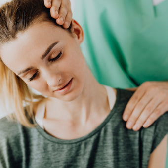 Woman getting neck cracked